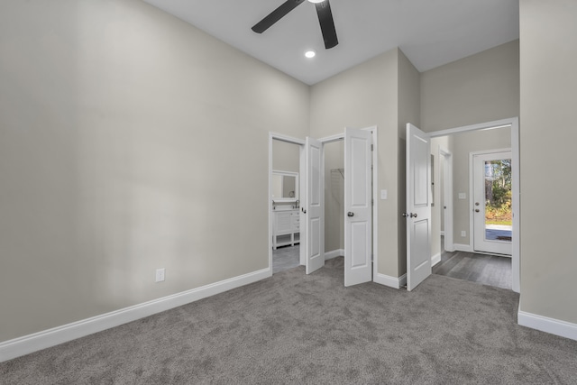 unfurnished bedroom featuring carpet floors and ceiling fan