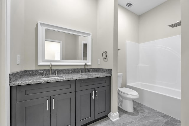 full bathroom with vanity, toilet, and shower / washtub combination