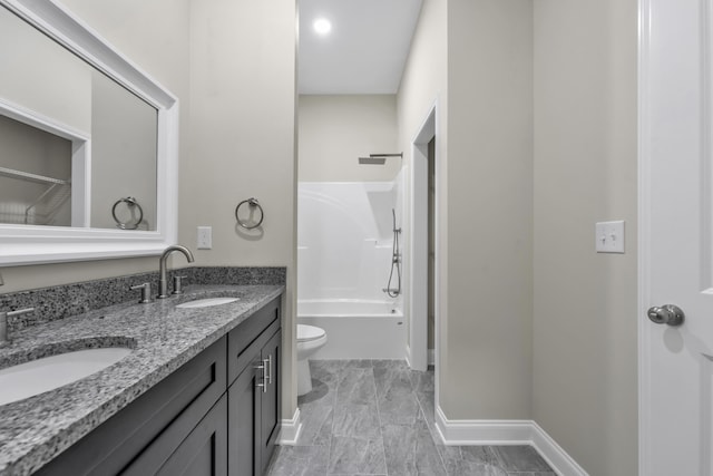 full bathroom featuring vanity, shower / bathtub combination, and toilet