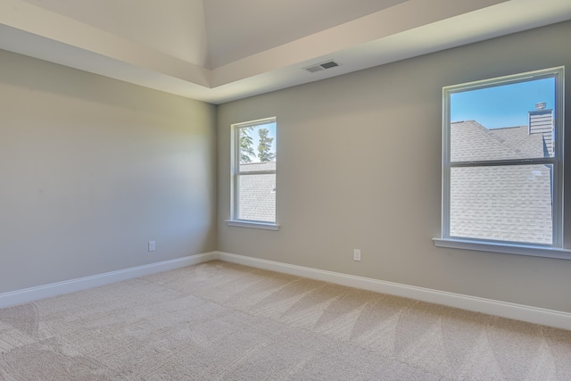 empty room featuring light carpet