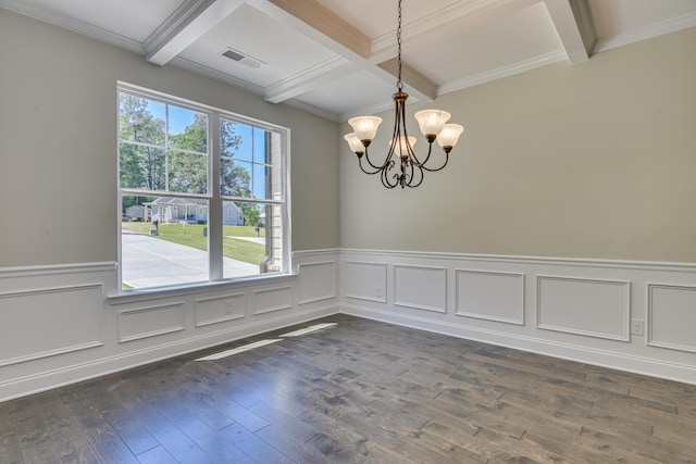 spare room featuring coffered ceiling, beam ceiling, a wealth of natural light, and a chandelier