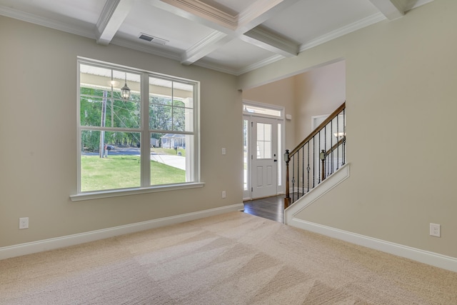 entryway featuring beam ceiling, carpet floors, ornamental molding, and coffered ceiling