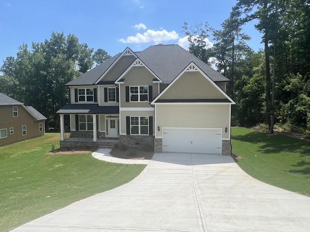 craftsman-style house with a front lawn, covered porch, and a garage