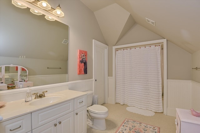 612 Emerald Xing, Evans, GA 30809 - full bathroom with lofted ceiling, wainscoting, vanity, tile patterned floors, and curtained shower