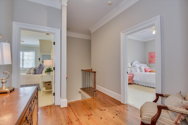 612 Emerald Xing, Evans, GA 30809 - hall with light wood-style floors, an upstairs landing, and crown molding