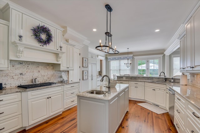 612 Emerald Xing, Evans, GA 30809 - kitchen featuring a chandelier, appliances with stainless steel finishes, decorative backsplash, white cabinets, and light wood-style floors
