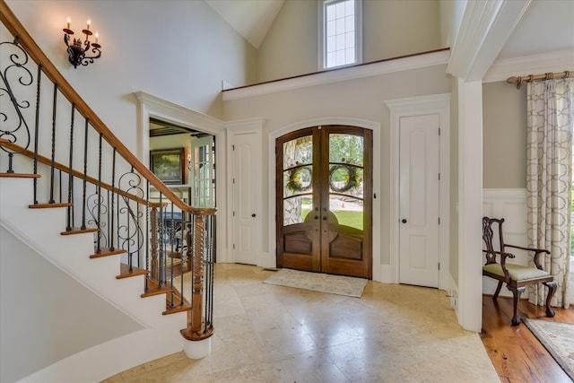 612 Emerald Xing, Evans, GA 30809 - entrance foyer with healthy amount of natural light, high vaulted ceiling, stairway, and french doors