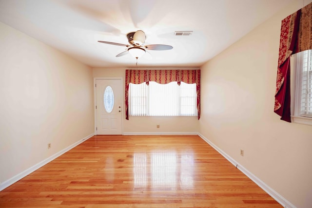 entryway with ceiling fan and light wood-type flooring