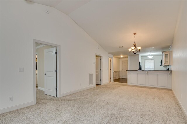 272 Harvester Dr, North Augusta, SC 29860 - unfurnished living room featuring a chandelier, lofted ceiling, and light carpet