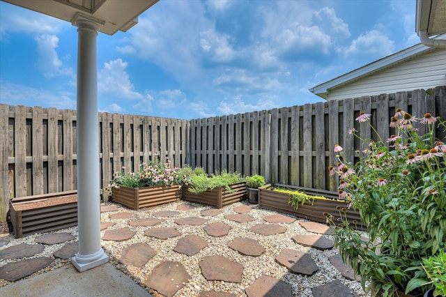 272 Harvester Dr, North Augusta, SC 29860 - view of patio featuring a garden