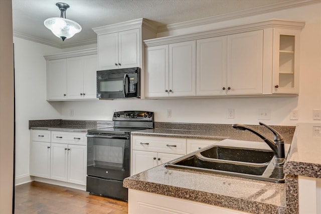 272 Harvester Dr, North Augusta, SC 29860 - kitchen with black appliances, wood finished floors, pendant lighting, crown molding, and dark countertops