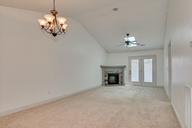 272 Harvester Dr, North Augusta, SC 29860 - unfurnished living room with vaulted ceiling, light colored carpet, ceiling fan, a chandelier, and a fireplace