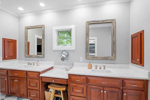 bathroom with ornamental molding and vanity