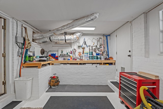 finished below grade area with a workshop area