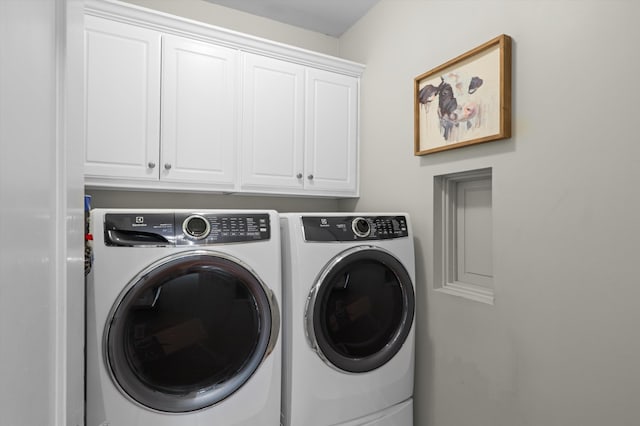 laundry room with washer and dryer and cabinet space