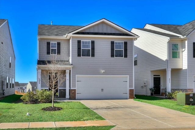 view of front facade with central AC unit, a garage, and a front lawn