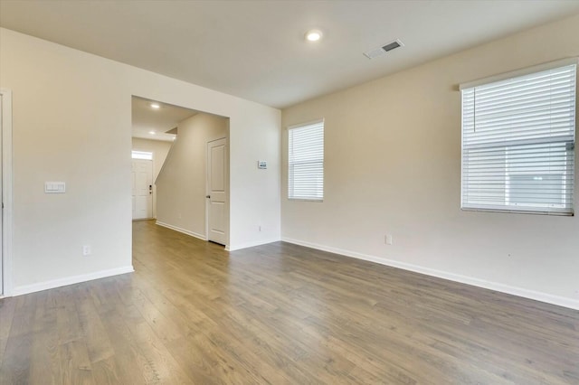 spare room featuring hardwood / wood-style flooring