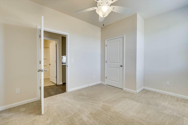 unfurnished bedroom with carpet and ceiling fan