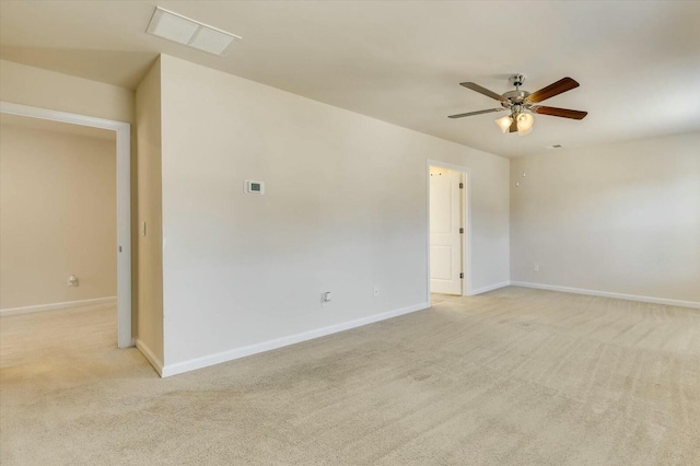 unfurnished room featuring light carpet and ceiling fan