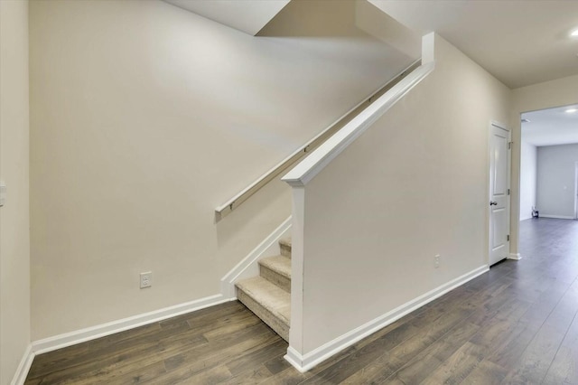 staircase featuring hardwood / wood-style floors