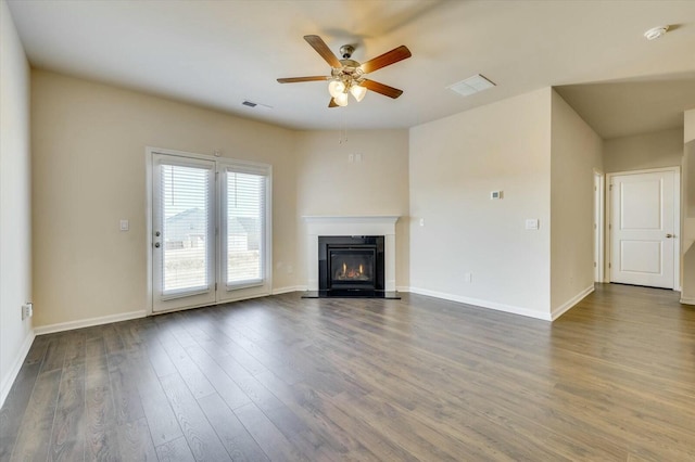 unfurnished living room featuring hardwood / wood-style floors and ceiling fan