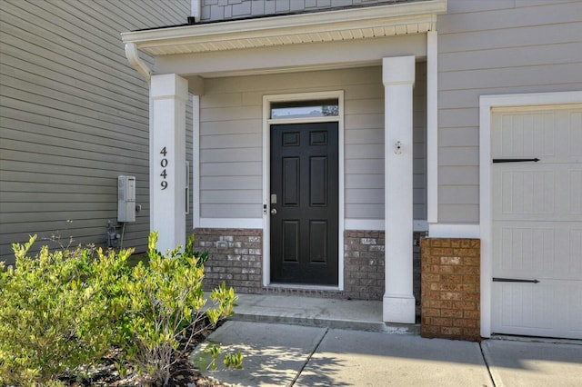 view of exterior entry featuring a garage