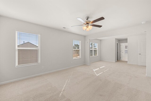 unfurnished bedroom featuring ceiling fan and light carpet