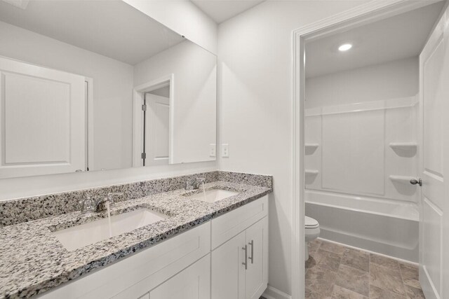 full bathroom featuring vanity, toilet, and bathtub / shower combination