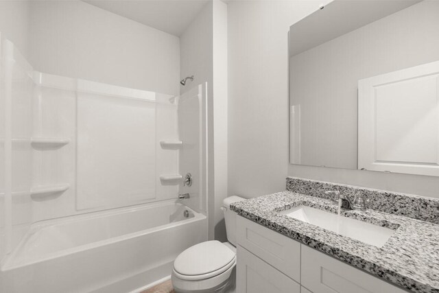 full bathroom with vanity, toilet, and shower / washtub combination