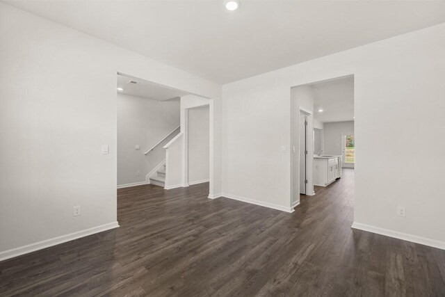 empty room featuring dark hardwood / wood-style flooring