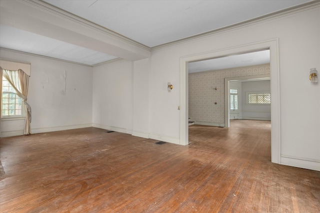 2131 Gardner St, Augusta, GA 30904 - unfurnished room featuring crown molding, healthy amount of natural light, wood finished floors, and baseboards