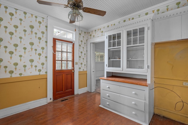 2131 Gardner St, Augusta, GA 30904 - foyer entrance with crown molding, a ceiling fan, wallpapered walls, dark wood-style floors, and a wainscoted wall