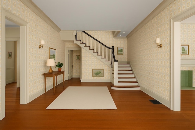 2131 Gardner St, Augusta, GA 30904 - foyer entrance featuring wallpapered walls, wood finished floors, stairs, baseboards, and crown molding