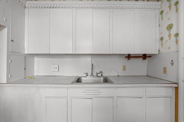 2131 Gardner St, Augusta, GA 30904 - kitchen featuring a sink, light countertops, and white cabinets