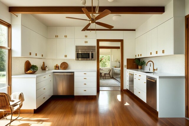 2131 Gardner St, Augusta, GA 30904 - kitchen with stainless steel dishwasher, ceiling fan, light countertops, beam ceiling, and dark wood-style flooring