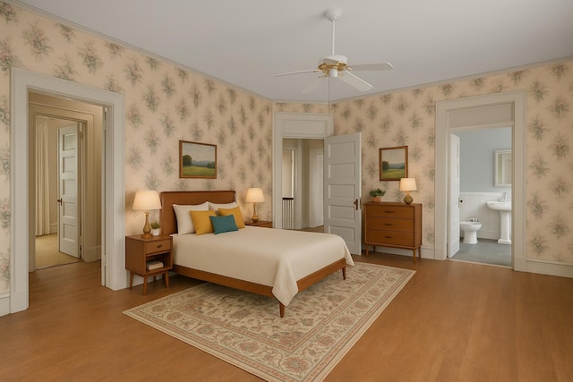 2131 Gardner St, Augusta, GA 30904 - bedroom with wood finished floors, wallpapered walls, ensuite bathroom, baseboards, and a ceiling fan