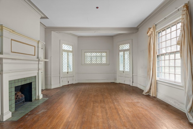 2131 Gardner St, Augusta, GA 30904 - unfurnished living room featuring hardwood / wood-style floors, a tile fireplace, healthy amount of natural light, and crown molding