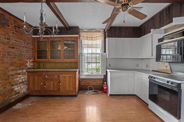 2131 Gardner St, Augusta, GA 30904 - kitchen with range with electric stovetop, a chandelier, light wood-type flooring, a textured ceiling, and ceiling fan