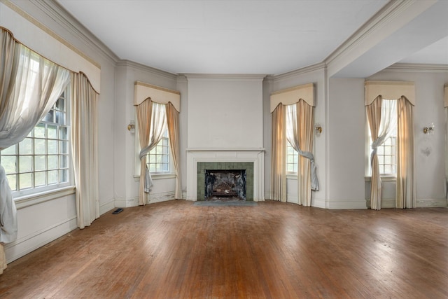 2131 Gardner St, Augusta, GA 30904 - unfurnished living room featuring hardwood / wood-style floors, a tiled fireplace, ornamental molding, and baseboards