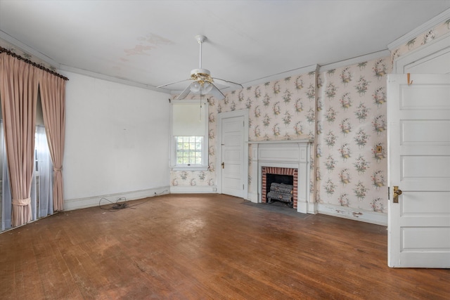 2131 Gardner St, Augusta, GA 30904 - unfurnished living room featuring a brick fireplace, ceiling fan, wood finished floors, wallpapered walls, and crown molding