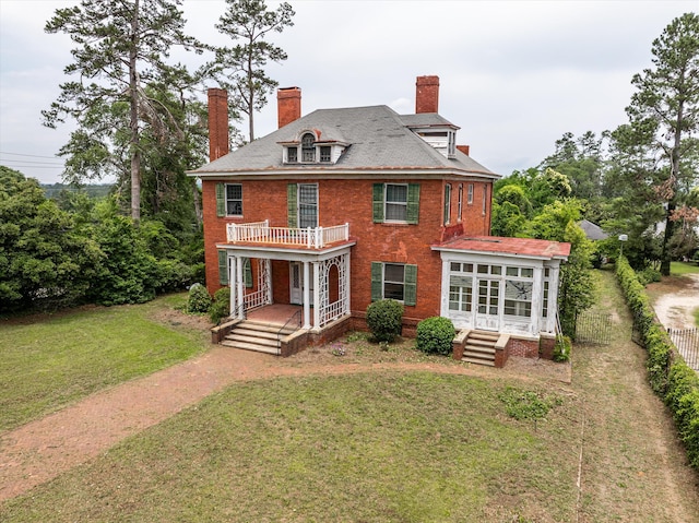 2131 Gardner St, Augusta, GA 30904 - rear view of property featuring a chimney, brick siding, dirt driveway, and a porch