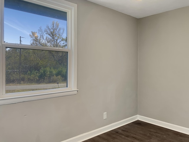 empty room featuring dark wood-type flooring