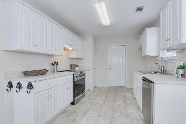 kitchen featuring sink, stainless steel appliances, and white cabinets