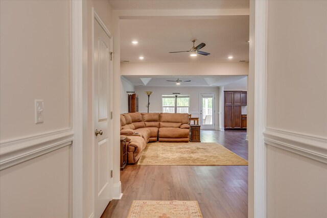 living room featuring a ceiling fan, recessed lighting, and wood finished floors