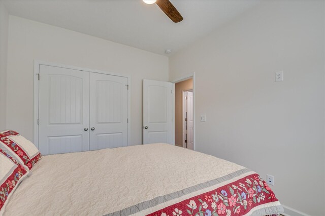 bedroom featuring a closet, a ceiling fan, and baseboards