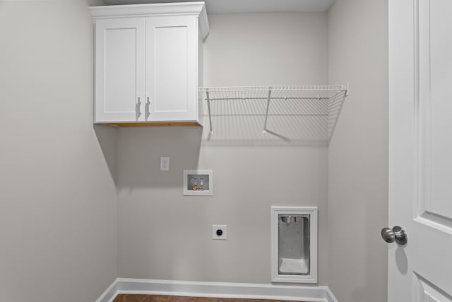 laundry area with hookup for a washing machine, electric dryer hookup, and cabinets