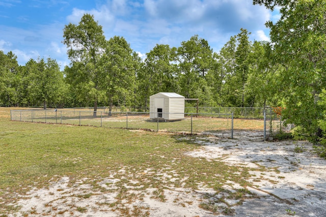 view of yard featuring a rural view and a shed