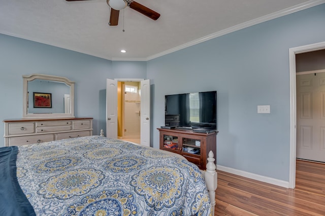 bedroom with hardwood / wood-style flooring, ceiling fan, and crown molding