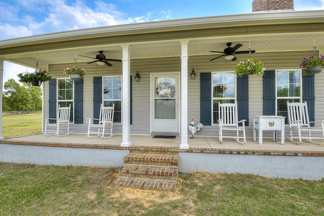 entrance to property featuring ceiling fan and a porch