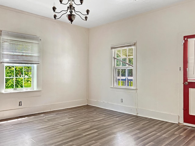 5639 Purvis School Rd, Stapleton, GA 30823 - unfurnished room with wood finished floors and a chandelier